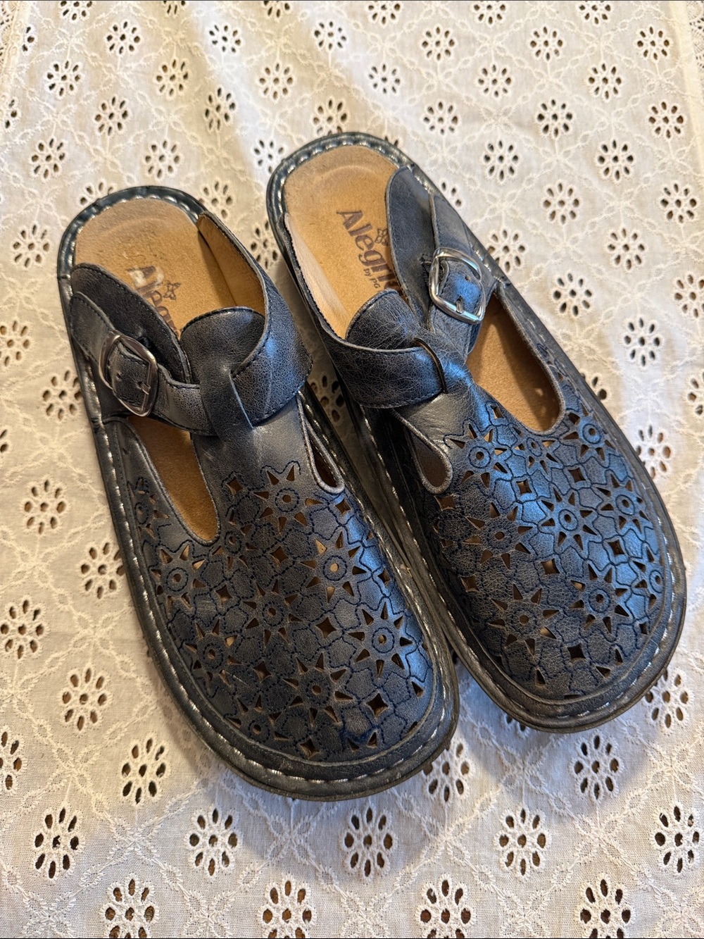 Alegria Navy Blue Floral Laser-Cut Leather Sandals